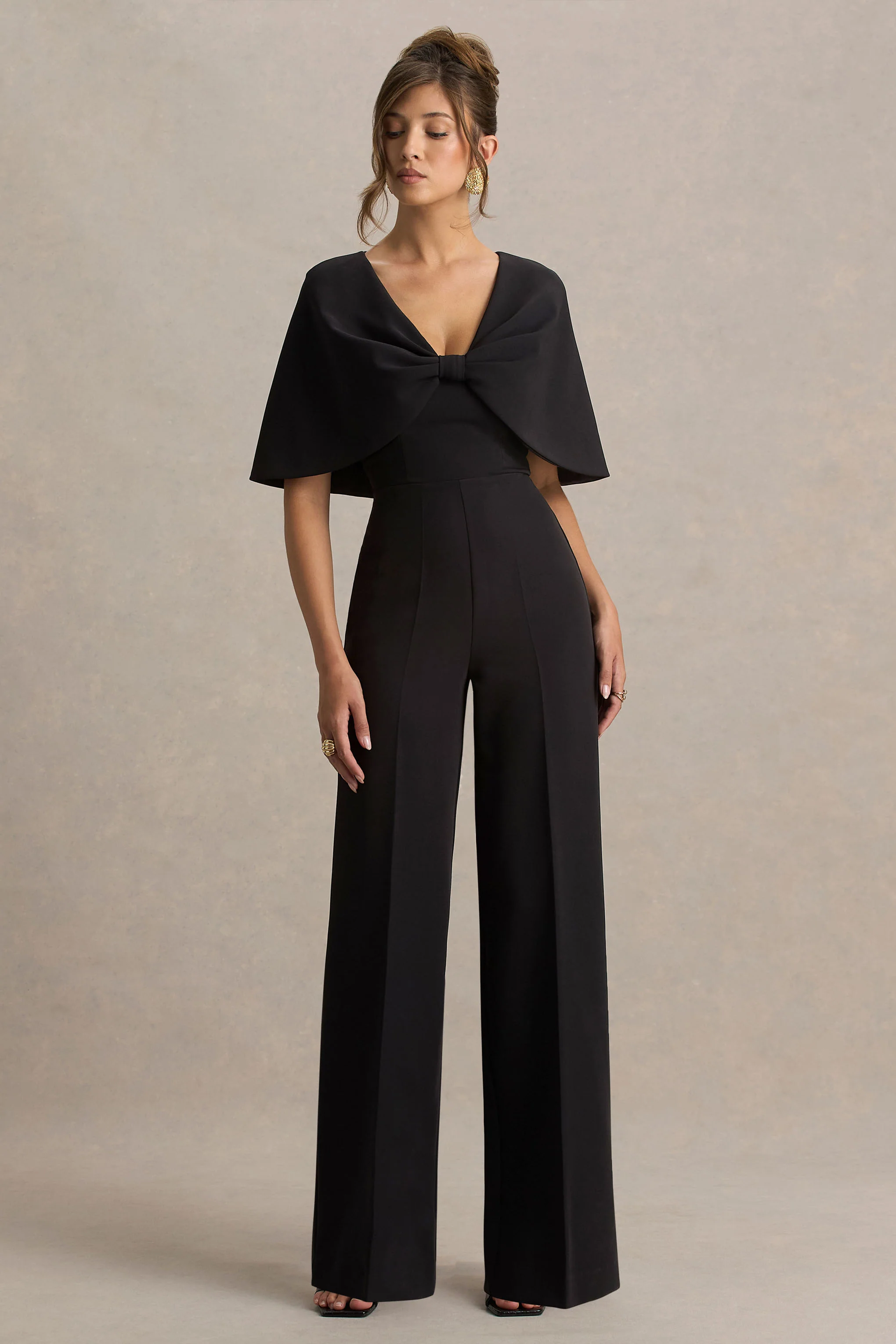 Vivid | Combinaison noire à décolleté plongeant, ornée d’un nœud - Image 4