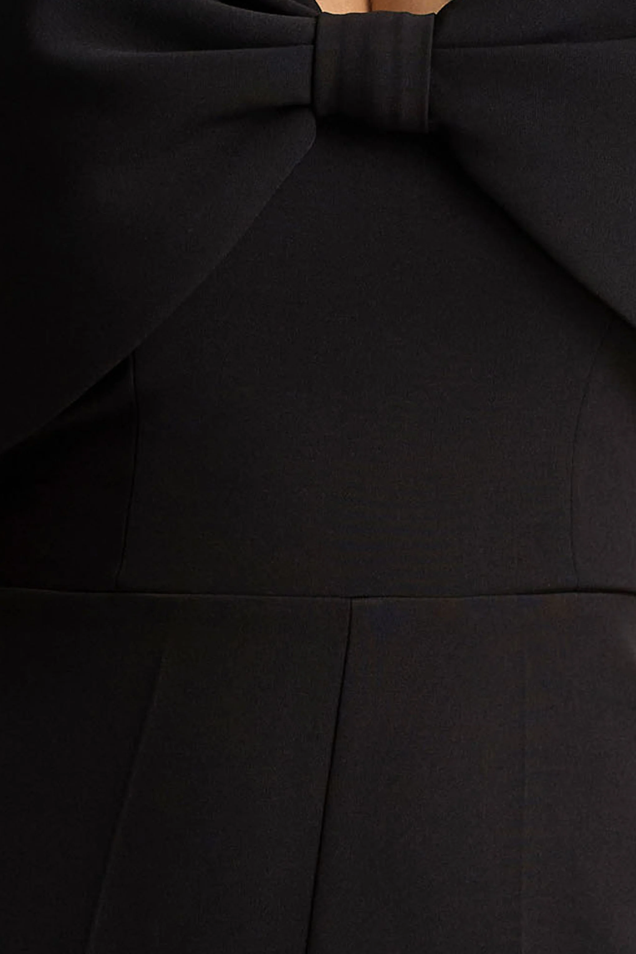 Vivid | Combinaison noire à décolleté plongeant, ornée d’un nœud - Image 5